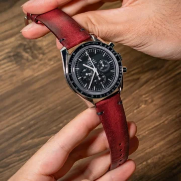 Red-metallic-strap-on-Omega-Speedmaster-made-by-Gunny-Straps