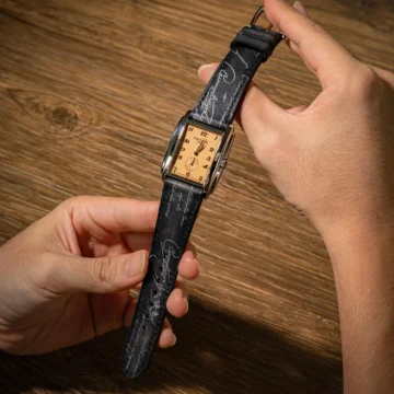 Black-patina-with-silver-scritto-strap-on-Patek-Philippe-Gondole-salmon-dial-made-by-Gunny-Straps