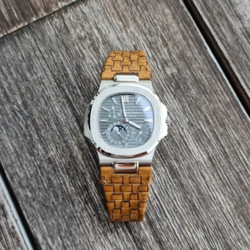 Weaved 360 rolled edge tan leather strap on Patek Philippe Nautilus made by Gunny Straps