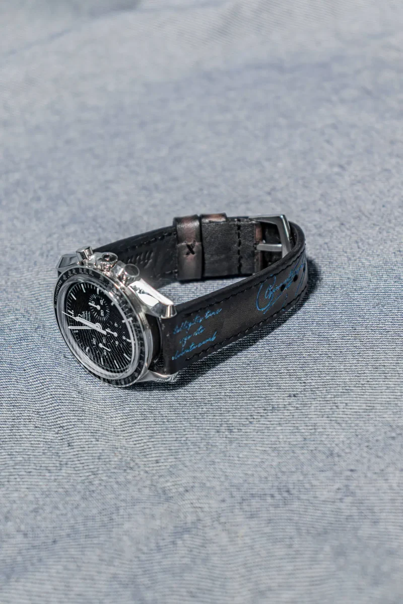 Black Patina with Blue Scritto on Omega Speedmaster by Gunny Straps