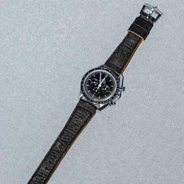 Mission Possible Black Strap on Omega Speedmaster by Gunny Straps