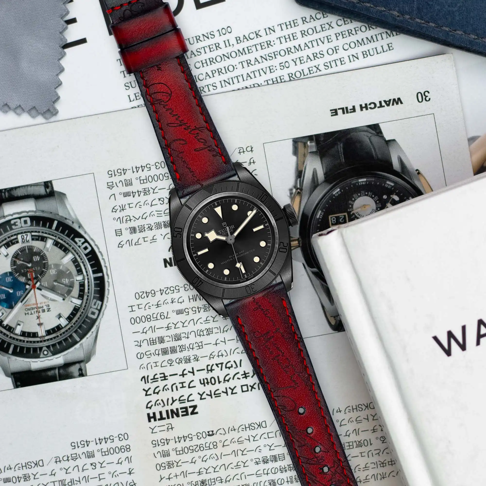 red-patina-scritto-strap-on-Tudor-black-bay-ceramic-made-by-Gunny-Straps